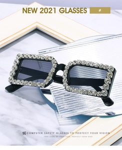 Macro detail of luxury square sunglasses featuring hand-set crystals and dark lenses