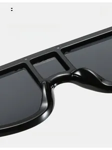 Detail view of oversized square sunglasses featuring comfortable integrated nose pads design