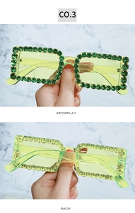 Detail view of square rhinestone-studded sunglasses in jelly green with 45-degree angle