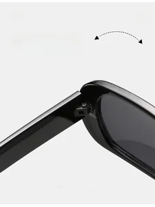 Macro detail of durable metal hinge on black oval sunglasses for long-lasting use