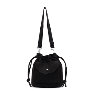 Minimalist black canvas drawstring bucket bag with adjustable strap and front pocket