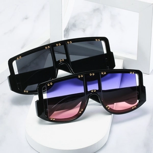 Oversized square shield sunglasses with gold studs and colorful gradient lenses