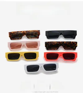 Detail of colorful rectangular sunglasses showing tortoiseshell, black, and pastel frames