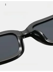 Close-up of smooth integrated nose pads on black square sunglasses for comfort