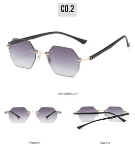 Detail view of rimless hexagonal sunglasses with purple gradient lenses and gold metal accents