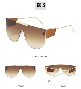 Three perspectives of oversized rimless gradient brown sunglasses with gold metal trim