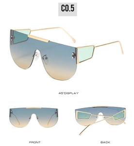 Detail view of gold shield sunglasses with blue-orange gradient lenses and side panel