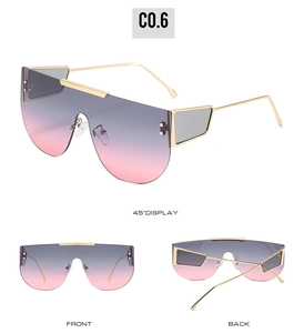 Detailed views of oversized gradient sunglasses with thin gold metal frame and tinted lenses