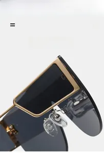 Detail showing the lightweight gold metal frame and comfortable nose pads of the sunglasses