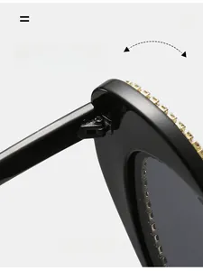 Macro detail of the durable metal hinge and sparkling rhinestone inlay on black sunglasses