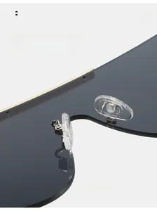Macro shot of oversized sunglasses showing soft silicone nose pads and metal bridge