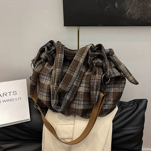 Vintage checkered corduroy hobo bag with wide strap and metallic rings for casual style