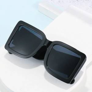Classic oversized black square sunglasses with glossy thick frames and dark lenses