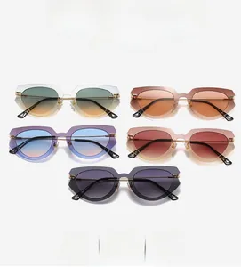Macro view of multi-color rimless cat eye sunglasses with tiered layered lens edges