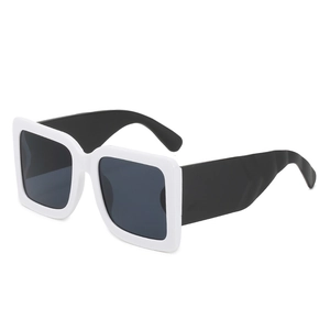 Fashionable square frame sunglasses with black and white color blocking design and dark lenses