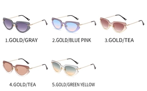 Detailed close-up of various trendy cat-eye sunglasses with colorful gradient lenses