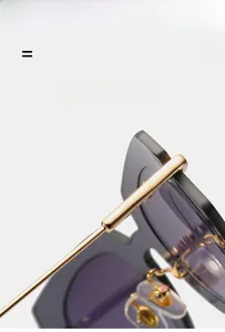 Detail view of cat eye sunglasses with gold metal hinges and flexible ultra-light frame