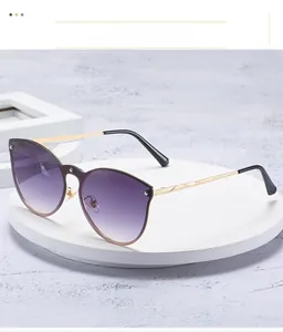 Macro detail of cat-eye sunglasses with purple gradient lenses and studded rivet edges