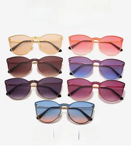 Close-up of cat-eye sunglasses collection with gradient lenses and gold metal frames