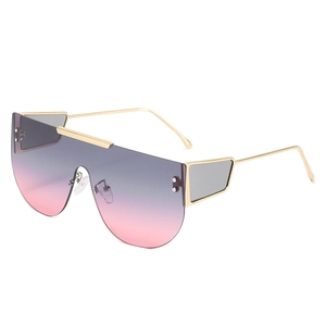 Oversized shield sunglasses with gold metal frame and purple gradient lenses