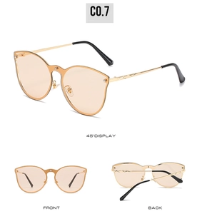 Three-view display of cat-eye sunglasses with gold metal frames and amber lenses