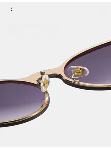 Detailed macro view of the gold metal bridge and transparent silicone nose pads on sunglasses