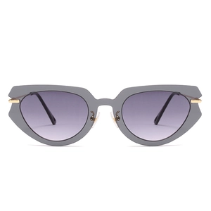 Irregular cat-eye sunglasses with dark grey frames and purple gradient lenses