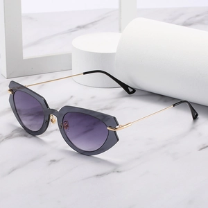 Modern cat-eye sunglasses with purple gradient lenses and slim gold metal temples