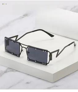 Detail of square sunglasses with silver rivets and unique lightning-shaped metal temples