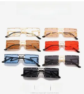 Detail of square rivet sunglasses with lightning lens design in multiple colors