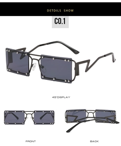Detail of square sunglasses with silver rivets and unique lightning-shaped metal temples