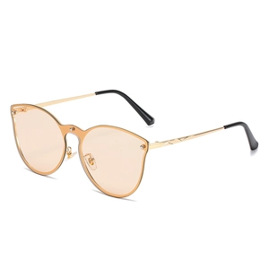Fashion cat-eye sunglasses with gold metal frame and orange lenses on white background