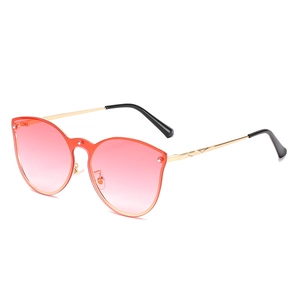 Cat eye sunglasses with pink gradient lenses and gold metal frame featuring rivet details