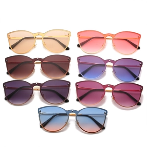 Trendsetting cat-eye rimless sunglasses with metal rivets in seven assorted vibrant colors