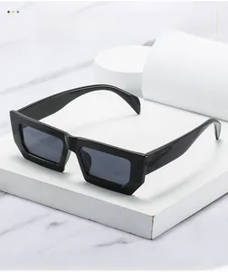 Detail of modern black rectangular sunglasses on minimalist geometric pedestals