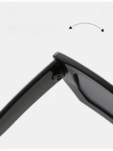 Detail of durable tight hinge on black square sunglasses with smooth finish