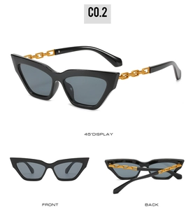 Detail view of black cat eye sunglasses featuring unique golden chain temple design