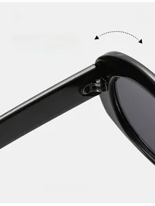 Detailed close-up of durable metal hinge on black oval sunglasses frame for long-term use