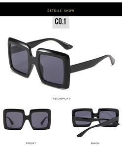 Detailed views of oversized square black sunglasses with wide frames and dark grey lenses