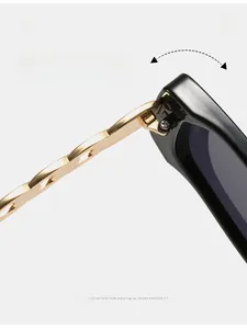Detail of durable texture hinge and gold chain temple on black square sunglasses