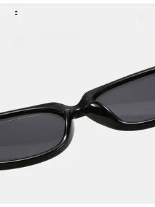 Detail view of smooth integrated nose pads on black acetate square sunglasses