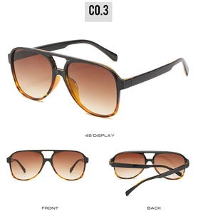 Detail view of vintage aviator sunglasses with tortoise frame and brown gradient lenses