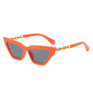 Retro orange cat-eye sunglasses with gold metal chain temple detail and grey lenses