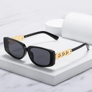 Fashionable rectangle sunglasses with black frame and bold gold chain metal temples