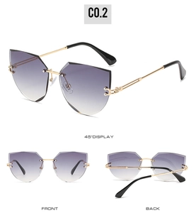 Multiple views of rimless cat eye sunglasses with purple gradient lenses and gold frame
