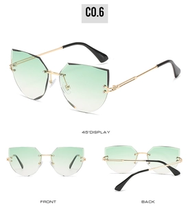 Multiple views of rimless cat-eye sunglasses with green gradient geometric cut lenses