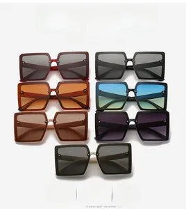 Detailed flat lay of oversized square sunglasses in seven vibrant colors with gold studs