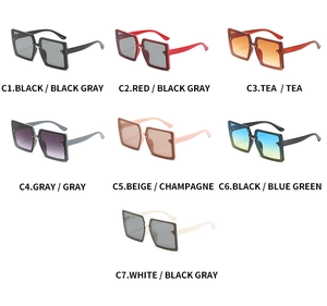 Variety of oversized square sunglasses in multiple lens and frame colors, macro view