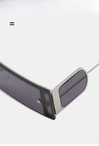 Detail of trendy small square sunglasses showing lightweight silver metal half-frame design