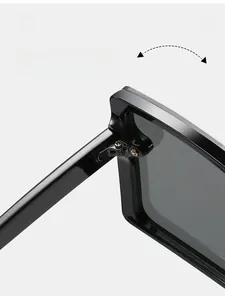 Macro shot of durable metal hinges on glossy black oversized square frame sunglasses